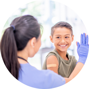 doctor giving high five to young boy wearing band aid on arm